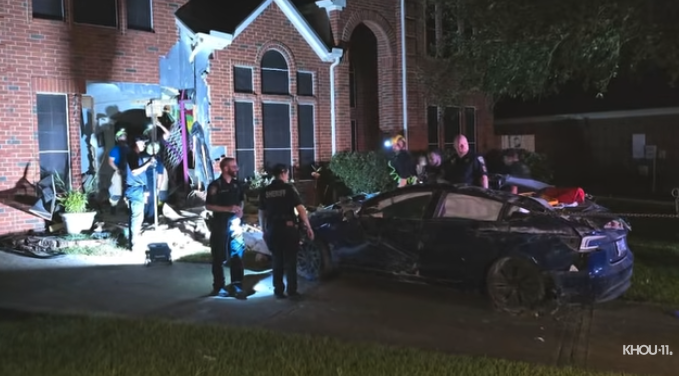 Tesla drives through house
